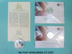 A 2007 one ounce silver Britannia and two 2013 £20 George and the Dragon silver coins