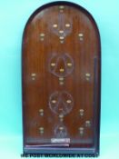 A Corinthian bagatelle board and a roll of velvet cloth.