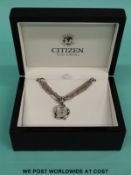 Citizen Eco-Drive ladies necklace watch with mother of pearl face, in original box with paperwork.