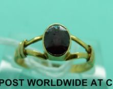 A late Georgian ring set with an oval garnet (size M)