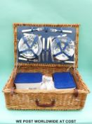 A wicker picnic hamper and contents,