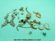 A pair of 9ct gold earrings, four pairs of yellow metal earrings,