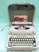 A Hermes 3000 vintage/retro portable typewriter.