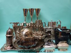 A quantity of plated ware including tea set, trays, goblets, candlesticks, bottle tickets etc.