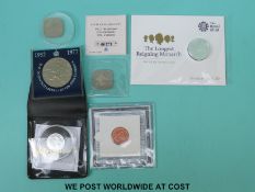 Two silver coins comprising £20 and £1 coin, together with crowns,