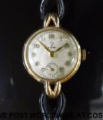 Tudor 9ct gold ladies wristwatch with inset subsidiary seconds dial, gold hands and Arabic numerals,