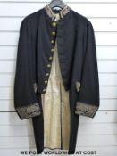 First half of 19th century tail coat with silver wirework brocade to cuffs, collar, waist and tail.
