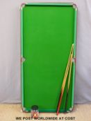 A 1/4 size snooker/billiards table and accessories