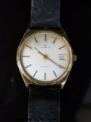 Garrard gentleman's wristwatch with date aperture, gold hands and two tone baton numerals,