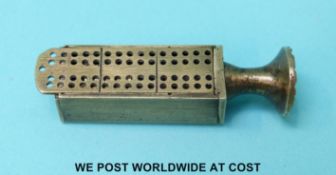 A novelty pipe tamper with slide out cribbage board lid,