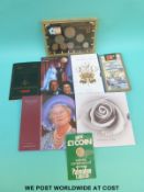 A collection of cased and sleeved collection coins including modern £5 examples, Diana,