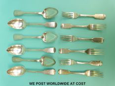 A set of six Victorian hallmarked silver fiddle pattern dinner forks and six matching table spoons,