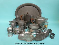 A collection of craftsman and other hammered Arts & Crafts/Art Deco pewter including tea set on
