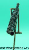 A Victorian stick pin in the form of a cricket bat,