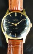 Smiths De Luxe gentleman's wristwatch with gold hands, baton markers and black face numerals,