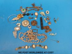 A quantity of costume jewellery to include a filigree bracelet, white metal filigree necklace,