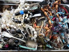 A collection of costume jewellery to include beaded necklaces, brooches etc.