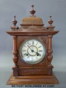 A carved early 20th century mantel clock by Tokyo Co.