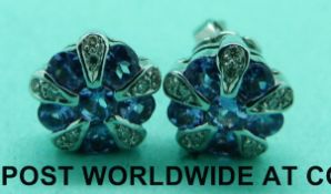 A pair of 9ct white gold earrings set with tanzanite