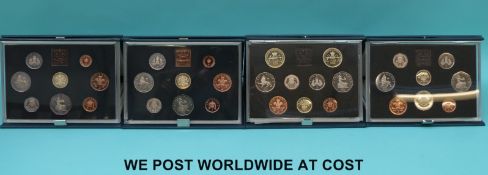 Four deluxe case UK proof coin sets comprising 1983 x 2,