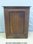 A 19thC oak corner cupboard with mahogany cross banding and single drawer below (109cm tall)
