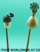 A gold stick pin set with an old cut diamond and a drop pearl (gold marks illegible) and a