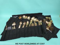 A large quantity of Thai bronze cutlery including napkin rings