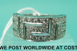 An 18ct white gold ring set with diamonds in Greek Key design (size P)