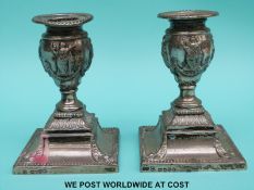 A pair of Victorian hallmarked silver candlesticks with neoclassical design,