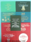 Nine overseas cased proof coin sets including Botswana, Tuvalu, Iceland, Zimbabwe,
