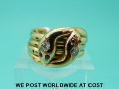 A Victorian 18ct gold ring in the form of two snakes entwined set with diamonds and rubies with