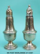 A pair of white metal mounted peppers marked Empire Sterling, weighted,
