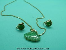 A 14ct gold necklace set with jadeite together with matching earrings