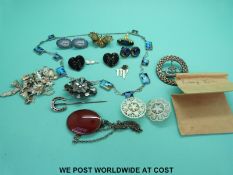 A Scottish hallmarked silver brooch, mother of pearl brooches, Victorian brooch set with agate,