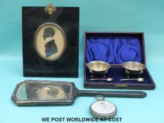 A hallmarked silver mounted hand mirror, cased plated salts,