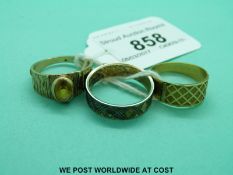 A yellow metal ring with cross design (2.