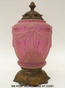 An Art Nouveau moulded and etched cranberry glass and gilt metal lamp, 39cm tall.