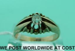 A 15ct gold ring set with a cushion cut diamond of approximately 0.