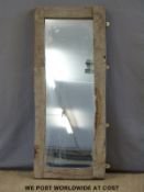 A hanging mirror with rustic wooden frame (121 x 49cm)
