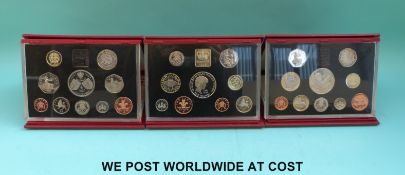 Three deluxe cased Royal Mint proof coin sets, 1997-1999, each contain the five pound crown,
