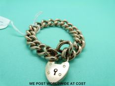 A Victorian 9ct gold curb link bracelet with 9ct gold padlock clasp (26.