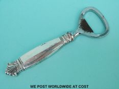 A Georg Jensen white metal handled bottle opener,