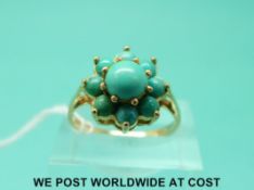 A 9ct gold ring set with turquoise in a cluster (size Q)