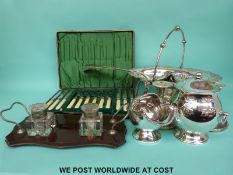 A quantity of silver plated ware including swing handled basket, cased cutlery, ladles etc.
