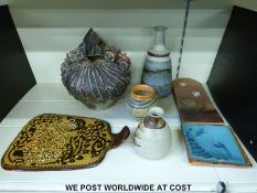 A collection of studio pottery including a plaque by Paul Gooderham and Canterbury studio pottery.