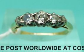 An 18ct gold ring set with five graduated diamonds (size M)