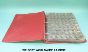 An album containing a large collection of UK silver coinage,