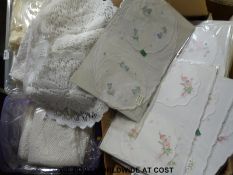 Three boxes containing a large quantity of table runners and similar furniture covers together with