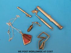 A white metal bracelet, gilt pencil, white metal pencil,