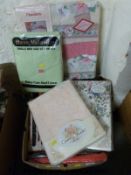 A box of single and King size bed linen in various colours together with two quilt sets by Country